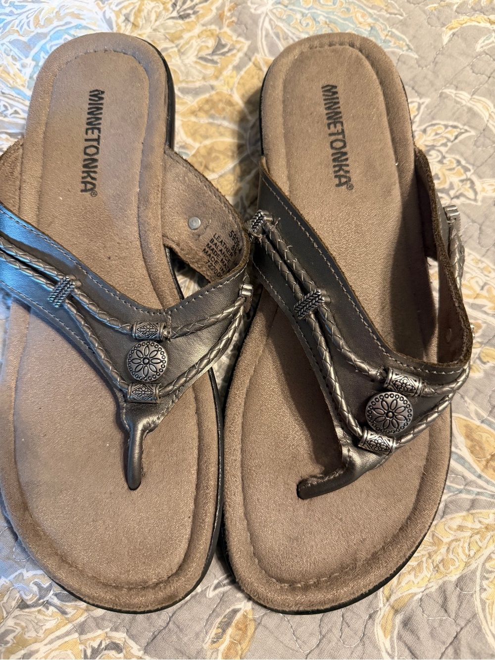 Minnetonka Women's Dark Brown Braided Thong Sandals with Concho Accent